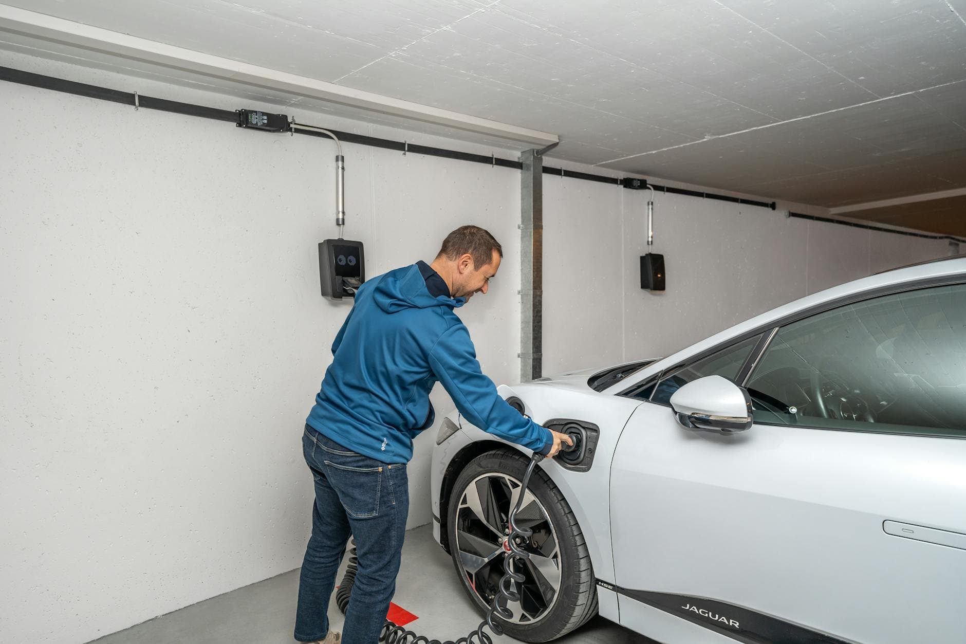 Electric vehicle charging in a residential garage